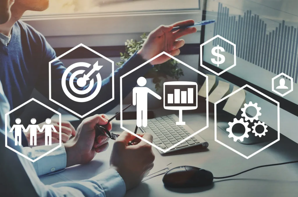 Two professionals discussing affiliate marketing strategy with bar graphs and business icons representing goals, analytics, and teamwork.